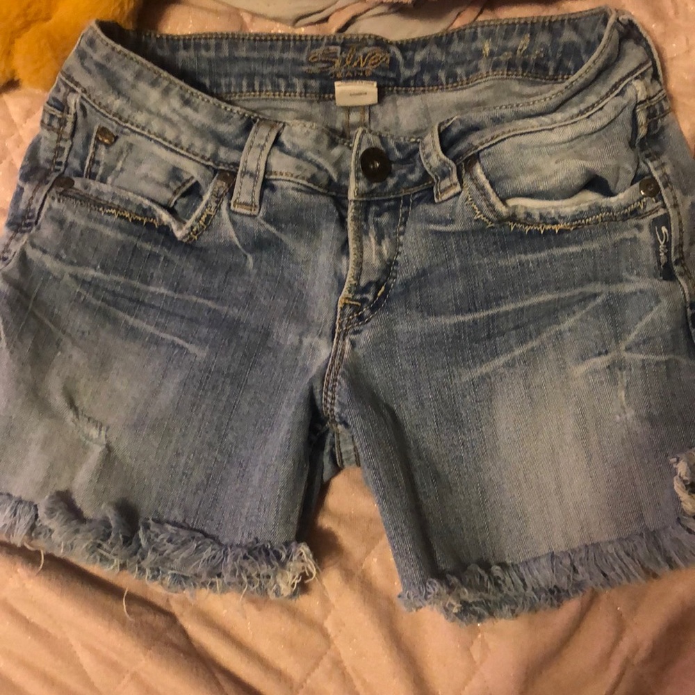 Silver shorts.